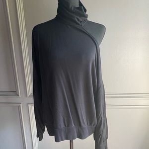Heavy turtle neck with shoulder cut out.  Dress it up or dress it down. Size L